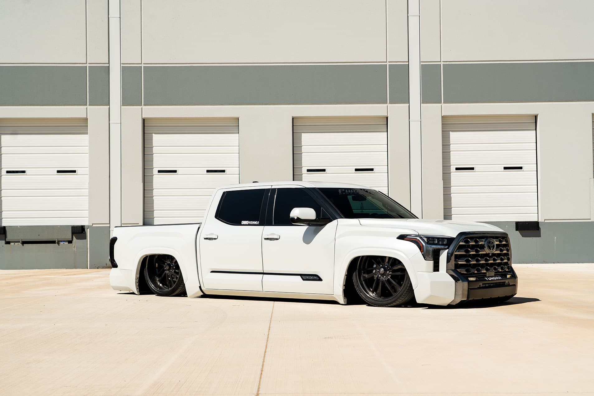 Lowered truck featured at Lone Star Throwdown 2024 with Air Lift Performance products